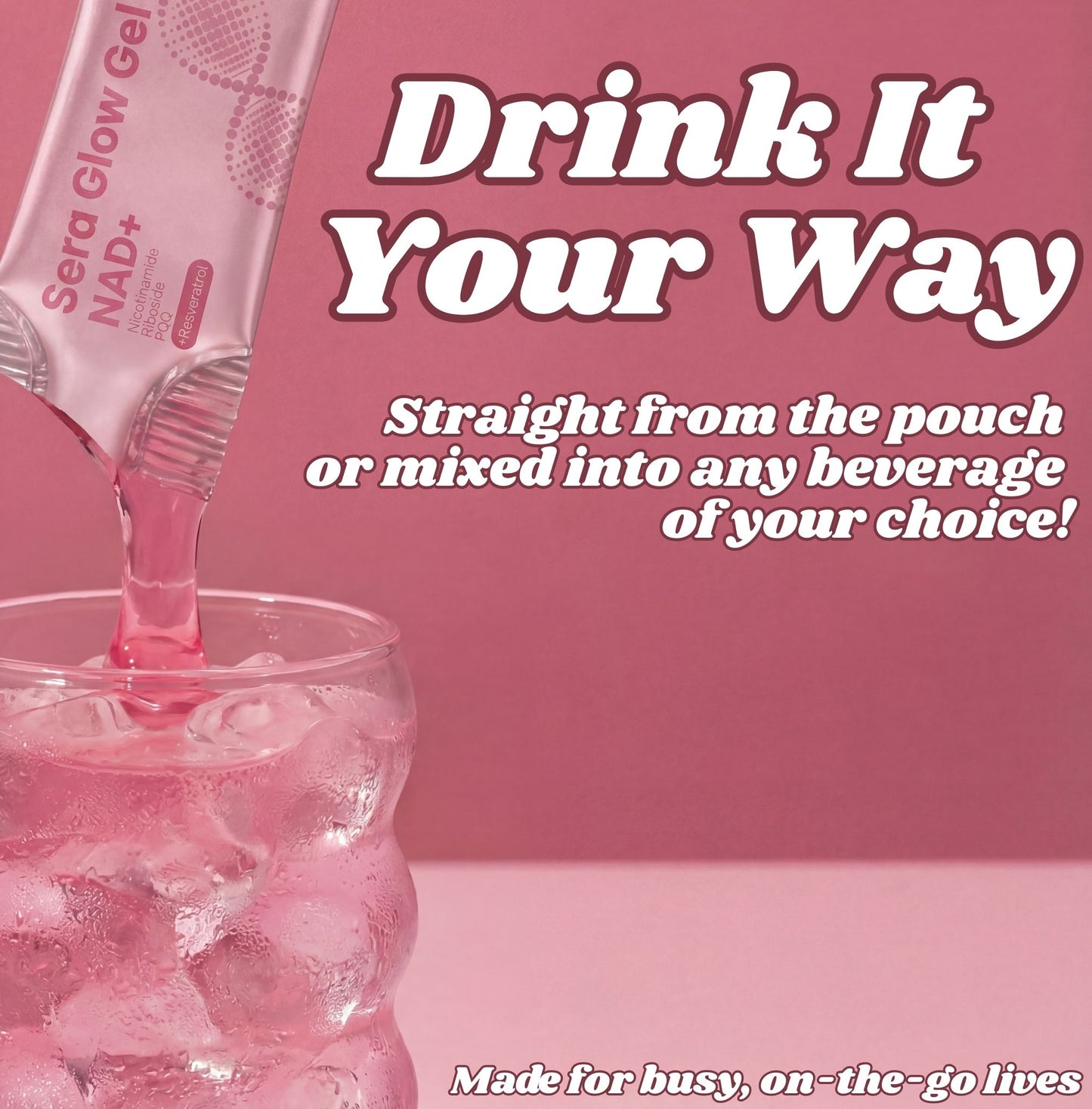 Pink drink being poured from a pouch into a glass with ice, on a pink background.
