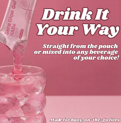 Pink drink being poured from a pouch into a glass with ice, on a pink background.
